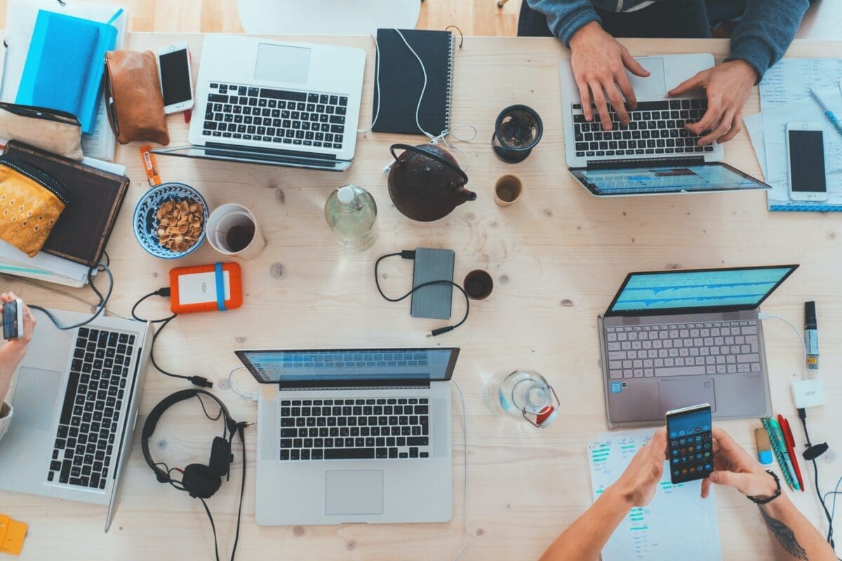 A group of people working on their laptops