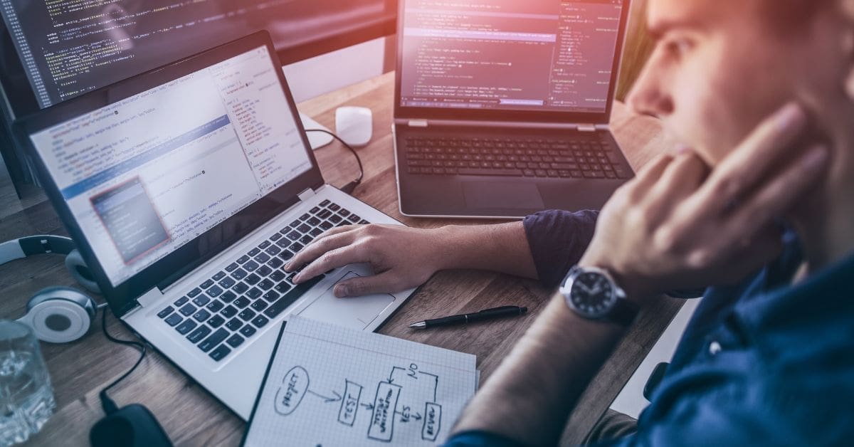 a person sitting at a desk searching a website