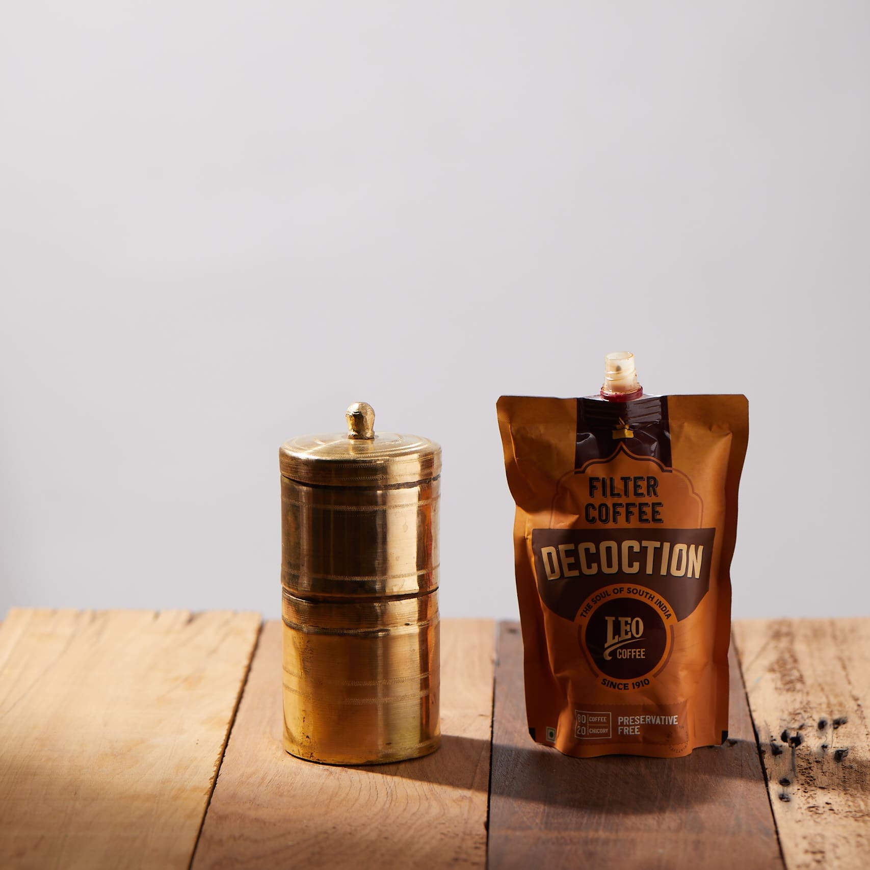 A Pack of Leo Coffee with the traditional brass coffee filter, a market that Leo Coffee wanted to expand with groSamriddhi E-Commerce Performance Marketing